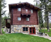 Log cabin with fireplace, minutes from skiing, snowmobiling, xc ski, and more!