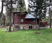 Log cabin with fireplace, minutes from skiing, snowmobiling, xc ski, and more!