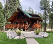 Log cabin with fireplace, minutes from skiing, snowmobiling, xc ski, and more!
