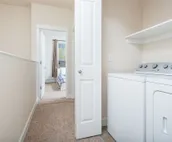Modern riverfront condo with hot tub, entertainment & river views