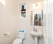 Modern riverfront condo with hot tub, entertainment & river views