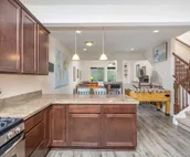 Modern riverfront condo with hot tub, entertainment & river views