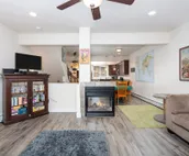 Modern riverfront condo with hot tub, entertainment & river views