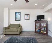 Modern riverfront condo with hot tub, entertainment & river views