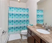 Modern riverfront condo with hot tub, entertainment & river views