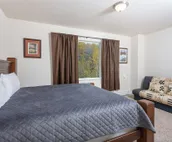 Modern riverfront condo with hot tub, entertainment & river views