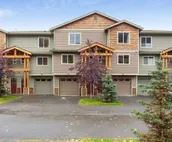 Modern riverfront condo with hot tub, entertainment & river views
