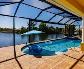 Scenic water view. 2 master suites with direct pool access. Villa Casa Amarilla