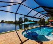 Scenic water view. 2 master suites with direct pool access. Villa Casa Amarilla