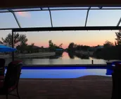 Scenic water view. 2 master suites with direct pool access. Villa Casa Amarilla