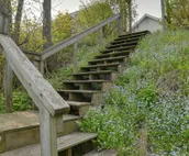 Lakefront De Tour Village Home w/ Deck & Fire Pit!