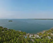 Lakefront De Tour Village Home w/ Deck & Fire Pit!