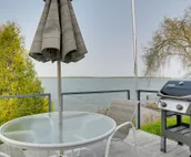 Lakefront De Tour Village Home w/ Deck & Fire Pit!