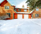 Roomy 2-story home with furnished deck, grill, fireplace, & great location