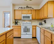 Spacious townhouse with ski & mountain views, deck, grill, & fireplace