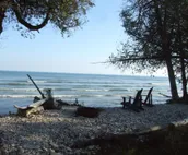 Beautiful Log Home on 5 quiet acres with private beach-steps down the road!