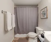 Modern city condo with Bluff Creek nature views