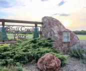 Modern city condo with Bluff Creek nature views