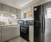 Modern city condo with Bluff Creek nature views