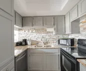 Modern city condo with Bluff Creek nature views