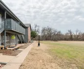 Modern city condo with Bluff Creek nature views