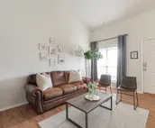 Modern city condo with Bluff Creek nature views