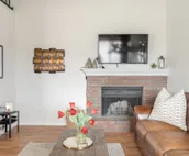 Modern city condo with Bluff Creek nature views