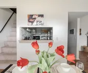 Modern city condo with Bluff Creek nature views