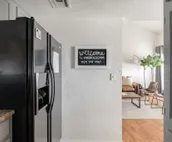 Modern city condo with Bluff Creek nature views