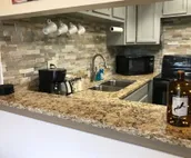 Modern city condo with Bluff Creek nature views