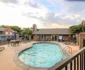 Modern city condo with Bluff Creek nature views