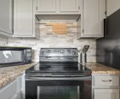 Modern city condo with Bluff Creek nature views