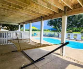 Dog-friendly golf getaway by the beach with private pool, hot tub & deck