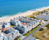 Amazing ocean & bay views from 3rd-floor condo with on-site pool & fitness ce...