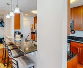 Amazing ocean & bay views from 3rd-floor condo with on-site pool & fitness ce...