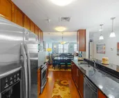 Amazing ocean & bay views from 3rd-floor condo with on-site pool & fitness ce...