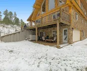 Custom cabin on 10 acres with firepit, wood stove, game room & forest views