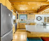 Custom cabin on 10 acres with firepit, wood stove, game room & forest views