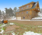 Custom cabin on 10 acres with firepit, wood stove, game room & forest views