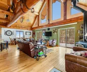 Custom cabin on 10 acres with firepit, wood stove, game room & forest views