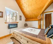 Custom cabin on 10 acres with firepit, wood stove, game room & forest views