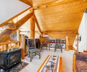 Custom cabin on 10 acres with firepit, wood stove, game room & forest views