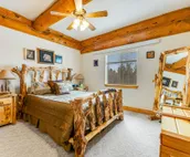 Custom cabin on 10 acres with firepit, wood stove, game room & forest views