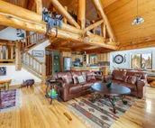 Custom cabin on 10 acres with firepit, wood stove, game room & forest views