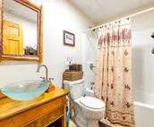 Custom cabin on 10 acres with firepit, wood stove, game room & forest views