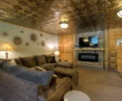 Hillside home with mountain view, wrap-around deck & great family room