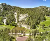 Hillside home with mountain view, wrap-around deck & great family room