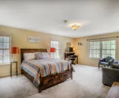 Hillside home with mountain view, wrap-around deck & great family room