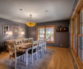 Hillside home with mountain view, wrap-around deck & great family room