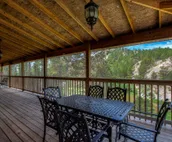 Hillside home with mountain view, wrap-around deck & great family room